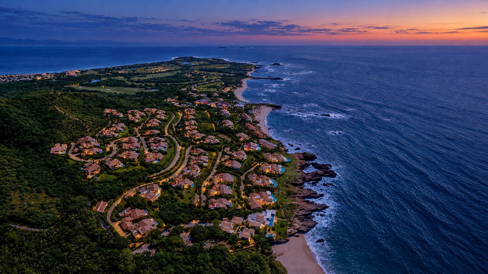 Aerial view of the Four Seasons Punta Mita resort at dusk