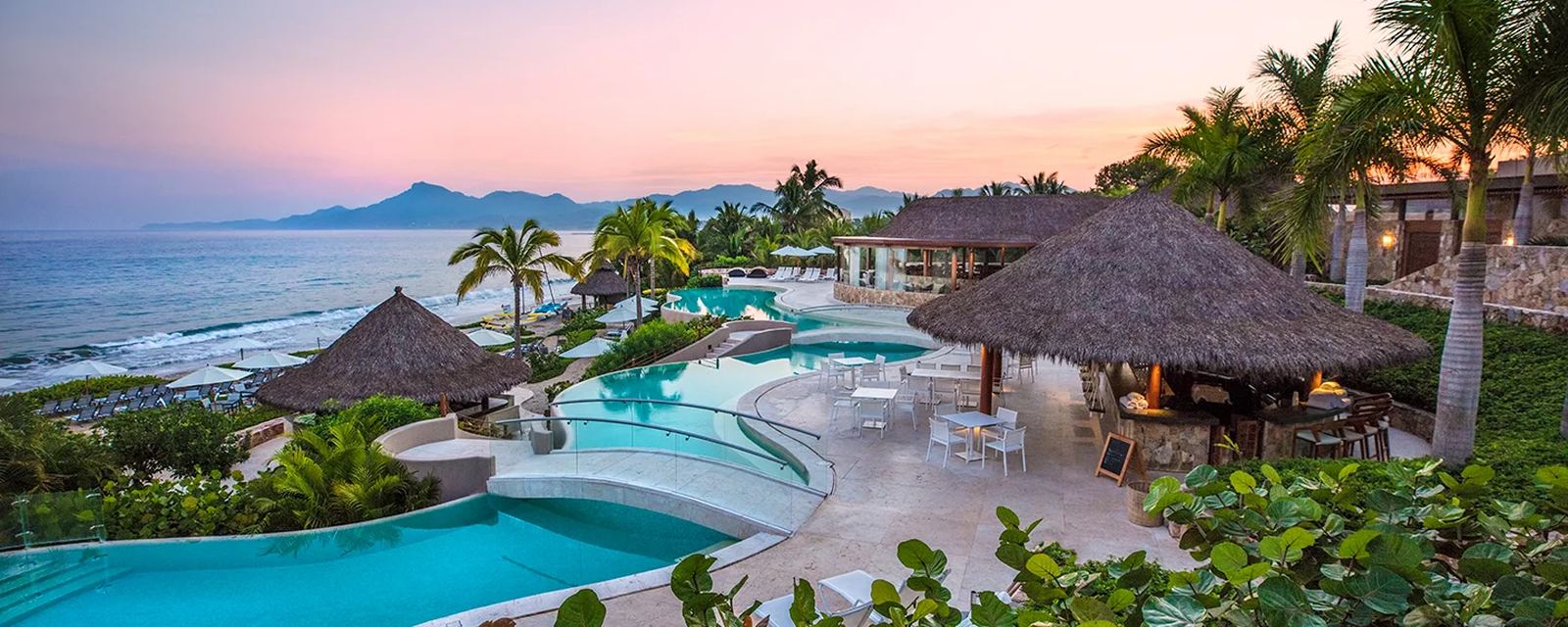 A beach club pool at sunset in Punta Mita